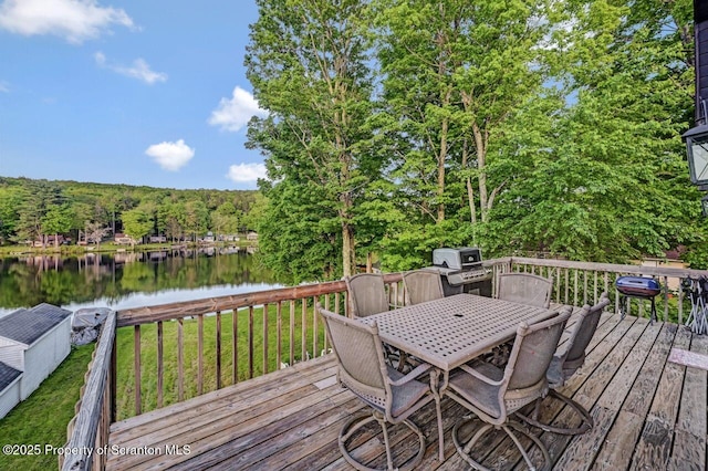 482 Lakeview Dr, Kingsley, PA 18826 - deck featuring outdoor dining space, a water view, grilling area, a yard, and a view of trees