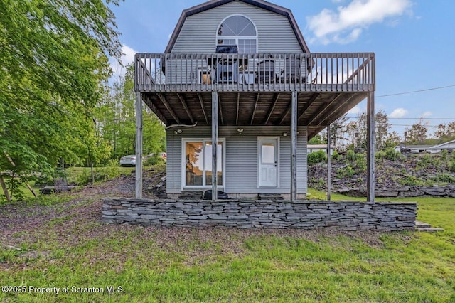 482 Lakeview Dr, Kingsley, PA 18826 - rear view of house with a wooden deck, a gambrel roof, and a yard