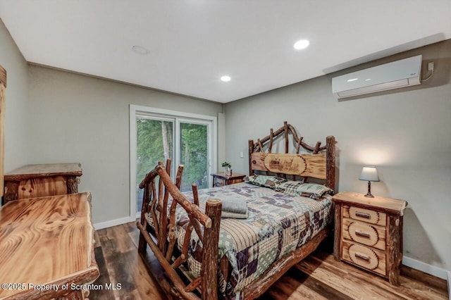 482 Lakeview Dr, Kingsley, PA 18826 - bedroom featuring an AC wall unit, wood finished floors, recessed lighting, baseboards, and access to outside