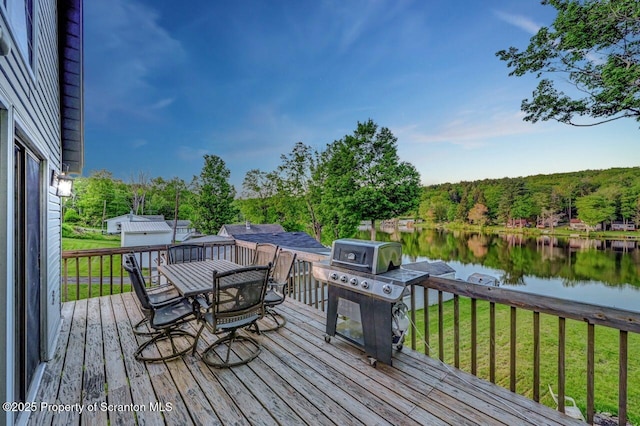 482 Lakeview Dr, Kingsley, PA 18826 - wooden deck with a water view, a lawn, area for grilling, and outdoor dining area