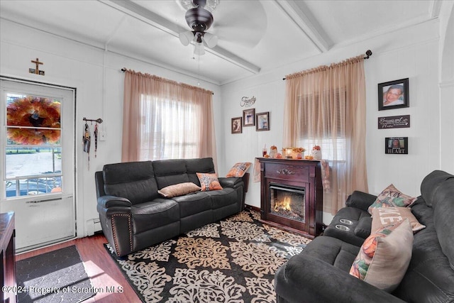 living room featuring hardwood / wood-style flooring, ceiling fan, beamed ceiling, and a baseboard radiator