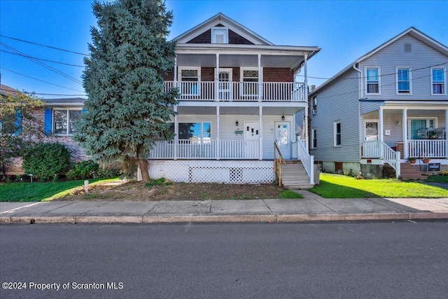 view of front of house with a balcony