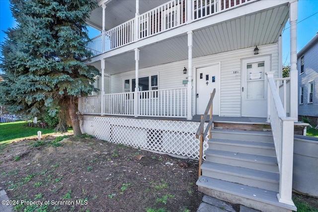 property entrance featuring a porch