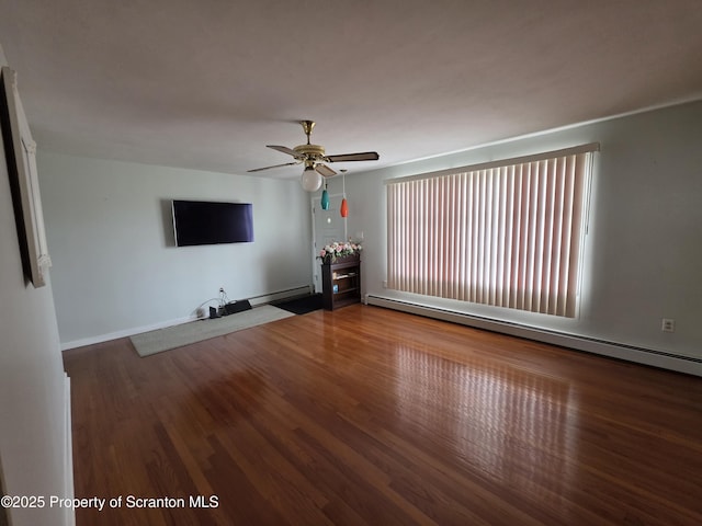 96 W Swallow St, Olyphant, PA 18447 - unfurnished living room featuring a baseboard radiator, ceiling fan, and wood finished floors