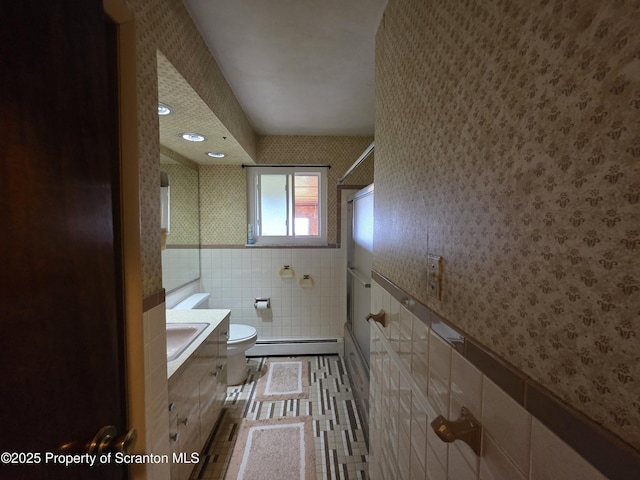 96 W Swallow St, Olyphant, PA 18447 - bathroom with wallpapered walls, a baseboard heating unit, vanity, a shower, and tile walls