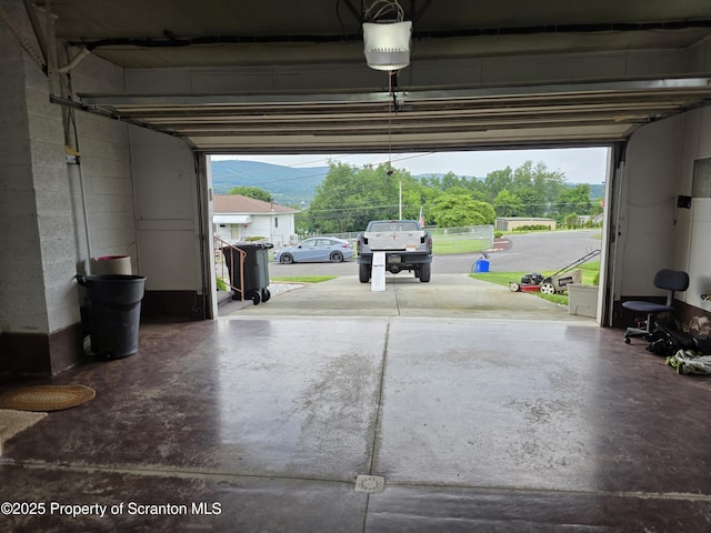 96 W Swallow St, Olyphant, PA 18447 - garage featuring a garage door opener