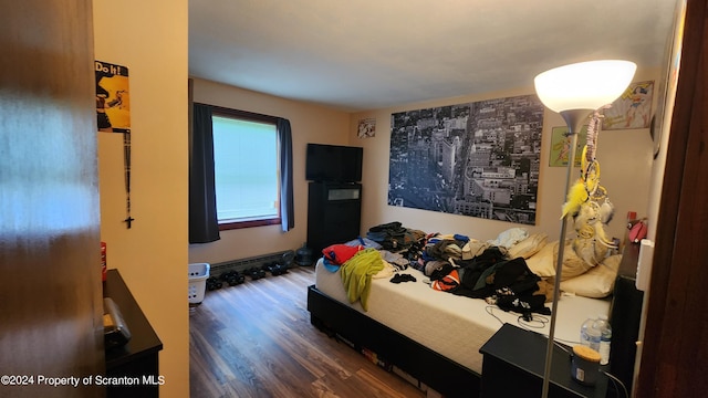 bedroom featuring dark hardwood / wood-style flooring