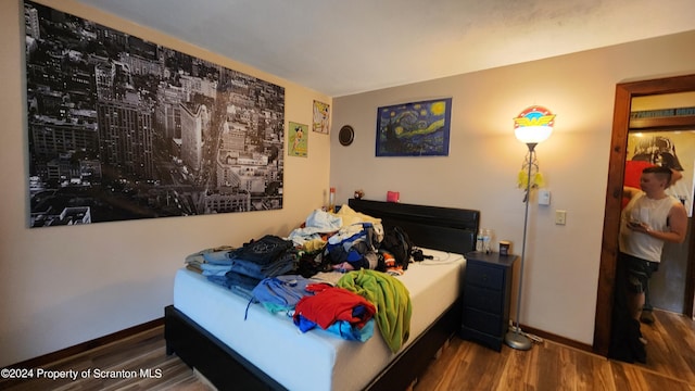 bedroom featuring dark hardwood / wood-style flooring