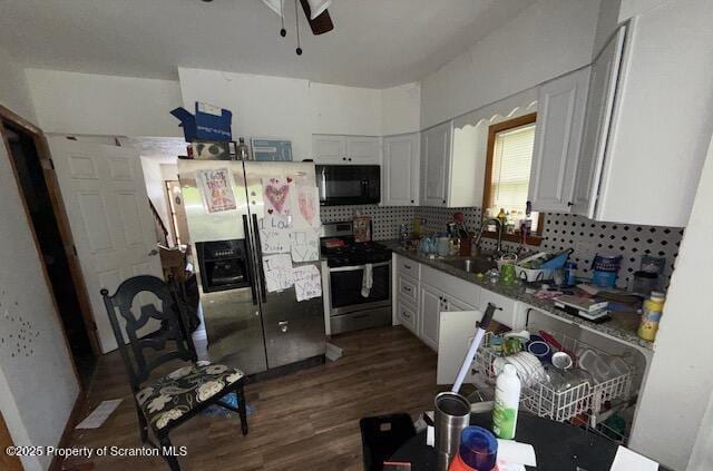 225 Taft St, Hanover Twp, PA 18706 - kitchen featuring appliances with stainless steel finishes, ceiling fan, decorative backsplash, dark wood finished floors, and white cabinetry