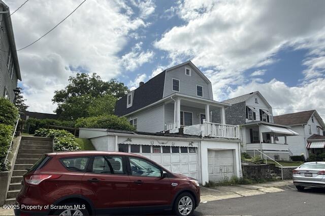 225 Taft St, Hanover Twp, PA 18706 - view of front of property featuring a gambrel roof, concrete driveway, and a garage