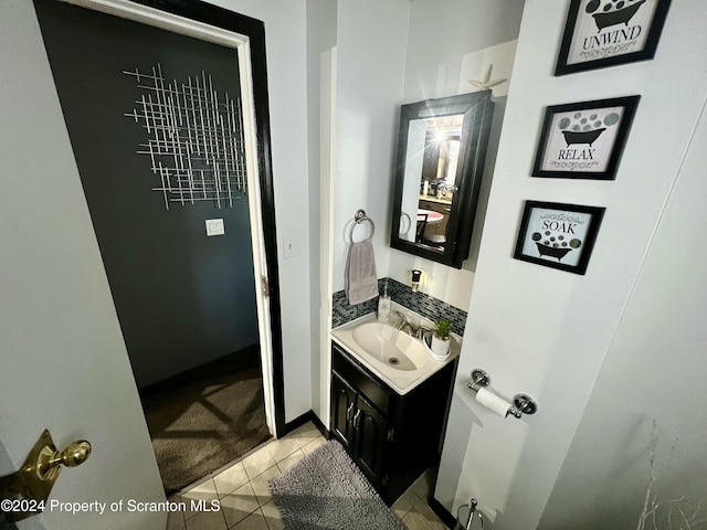 bathroom with tile patterned flooring and vanity