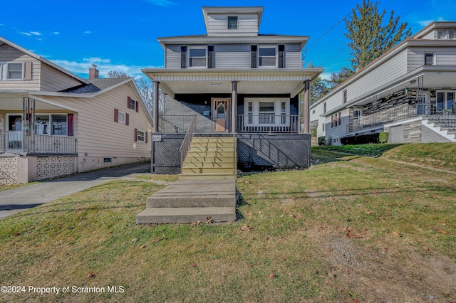 view of front of property featuring a front lawn and a porch