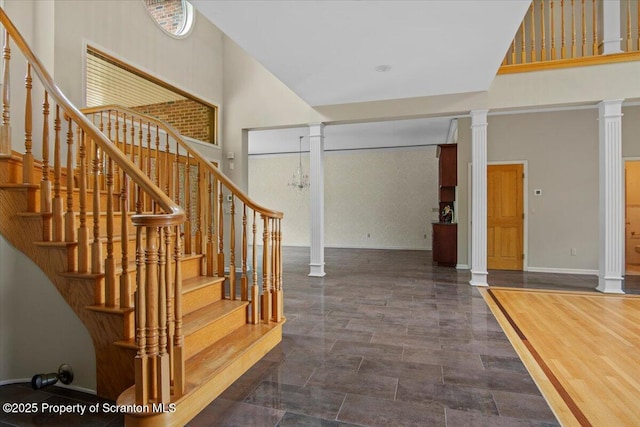 441 Hidden Lake Dr, East Stroudsburg, PA 18302 - stairway featuring a towering ceiling and ornate columns