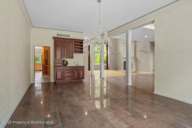 441 Hidden Lake Dr, East Stroudsburg, PA 18302 - dining room featuring decorative columns, plenty of natural light, a chandelier, crown molding, and a textured wall