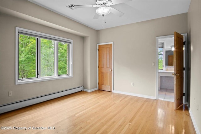 441 Hidden Lake Dr, East Stroudsburg, PA 18302 - unfurnished bedroom with a baseboard heating unit, light wood-style flooring, and ensuite bathroom