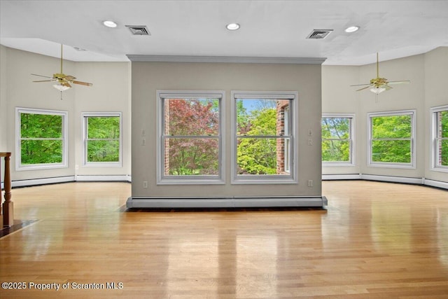 441 Hidden Lake Dr, East Stroudsburg, PA 18302 - unfurnished living room with a ceiling fan, wood finished floors, a baseboard radiator, and recessed lighting