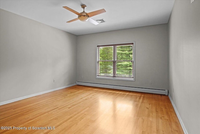441 Hidden Lake Dr, East Stroudsburg, PA 18302 - empty room with a baseboard heating unit, wood finished floors, and a ceiling fan