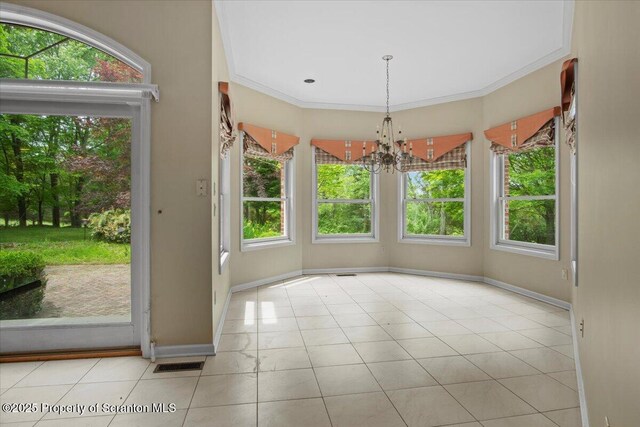 441 Hidden Lake Dr, East Stroudsburg, PA 18302 - unfurnished dining area featuring healthy amount of natural light, a chandelier, tile patterned flooring, and ornamental molding
