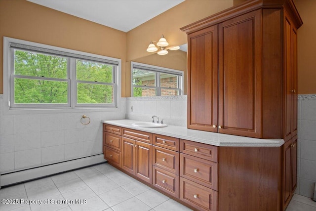 441 Hidden Lake Dr, East Stroudsburg, PA 18302 - bathroom with a baseboard heating unit, tile walls, tile patterned flooring, vanity, and a wainscoted wall