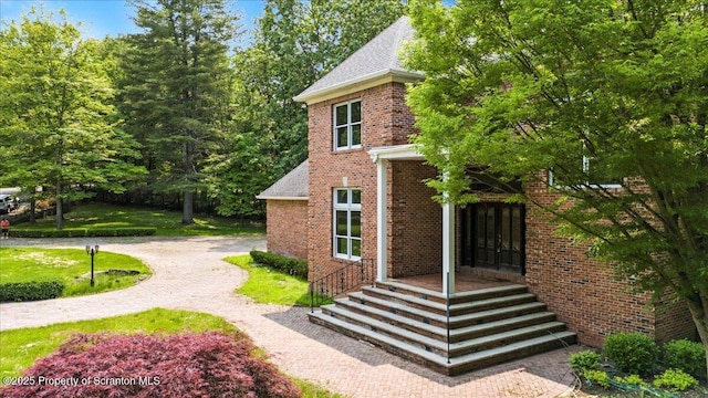 441 Hidden Lake Dr, East Stroudsburg, PA 18302 - view of side of property with brick siding and a shingled roof