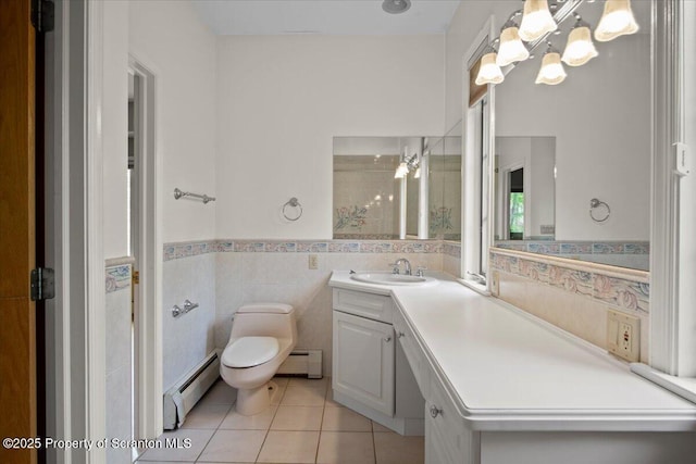 441 Hidden Lake Dr, East Stroudsburg, PA 18302 - bathroom with a baseboard radiator, tile patterned floors, vanity, a chandelier, and tile walls