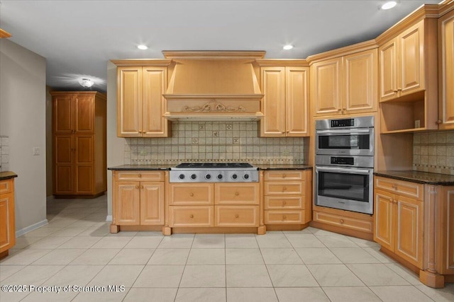 441 Hidden Lake Dr, East Stroudsburg, PA 18302 - kitchen with custom exhaust hood, stainless steel appliances, tasteful backsplash, recessed lighting, and light tile patterned flooring
