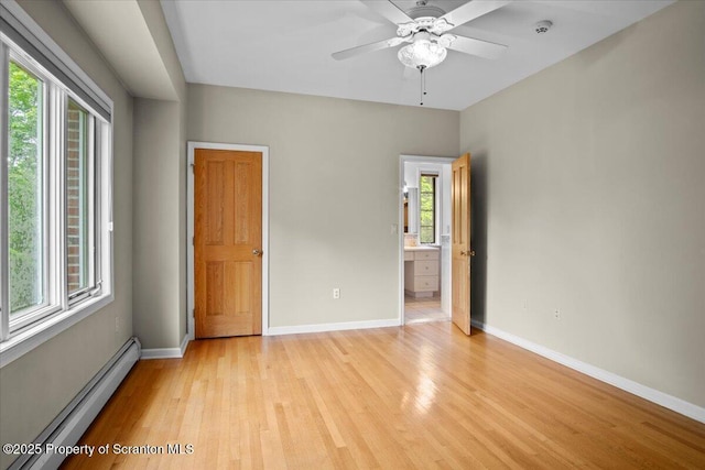 441 Hidden Lake Dr, East Stroudsburg, PA 18302 - unfurnished bedroom with a baseboard radiator, light wood-type flooring, and ensuite bathroom