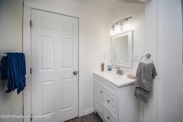 bathroom featuring hardwood / wood-style flooring and vanity