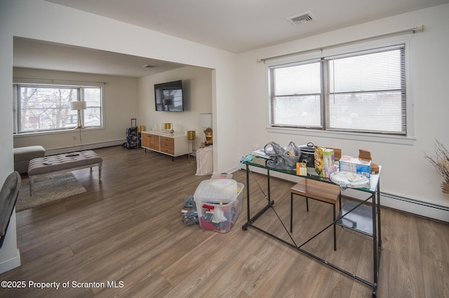 dining area with dark hardwood / wood-style flooring