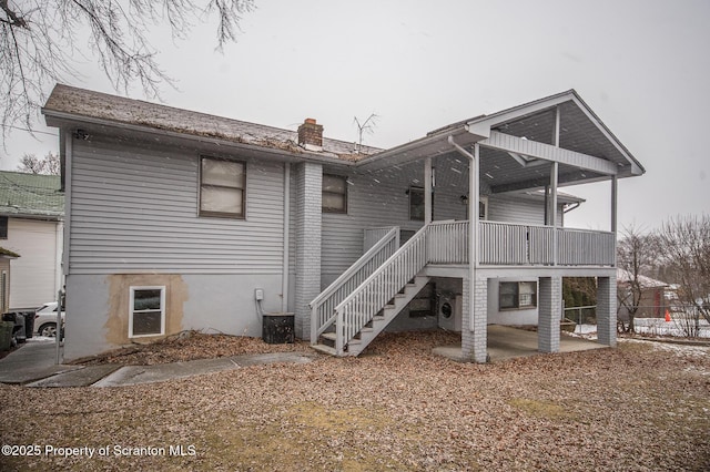 back of property with a patio and central air condition unit