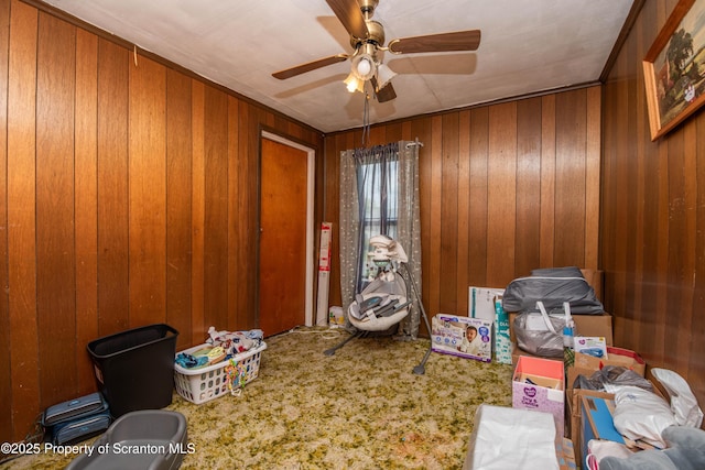 1010 Wood St, Old Forge, PA 18518 - miscellaneous room featuring a ceiling fan, carpet floors, and wooden walls