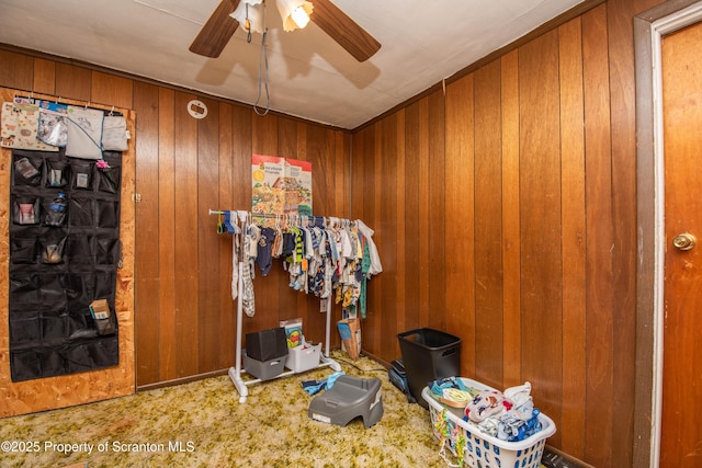 1010 Wood St, Old Forge, PA 18518 - miscellaneous room featuring carpet flooring, a ceiling fan, and wooden walls