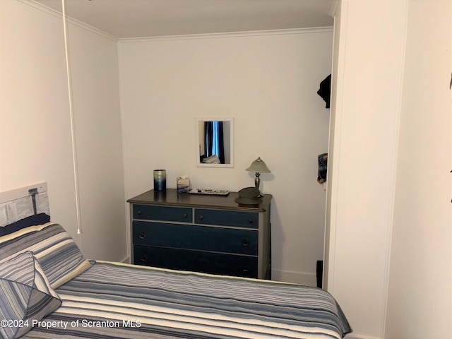 bedroom with crown molding