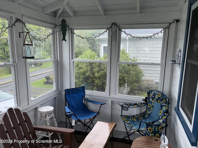 sunroom / solarium with beamed ceiling