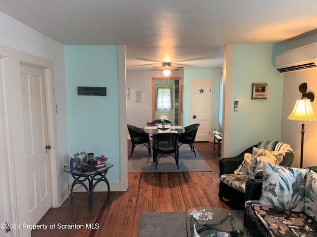 dining area featuring ceiling fan, dark wood-type flooring, and a wall mounted air conditioner