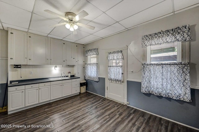 126-128 S Rebecca Ave S, Scranton, PA 18504 - kitchen featuring a sink, ceiling fan, dark wood-style flooring, decorative backsplash, and white cabinets