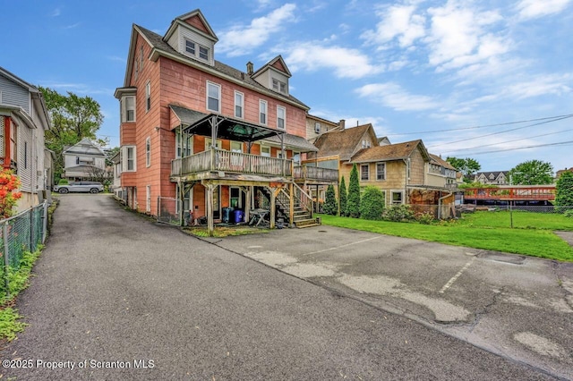 126-128 S Rebecca Ave S, Scranton, PA 18504 - rear view of property with a wooden deck, stairway, and a residential view