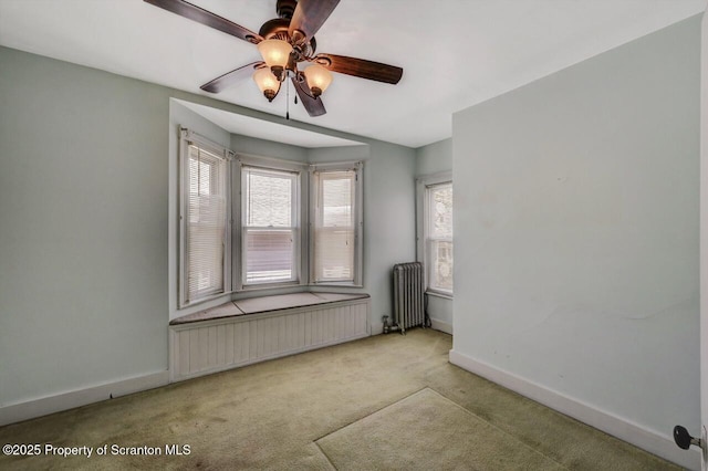126-128 S Rebecca Ave S, Scranton, PA 18504 - unfurnished room with radiator heating unit, radiator, carpet floors, baseboards, and ceiling fan