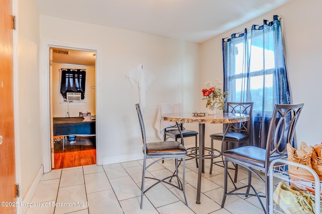 dining space with tile patterned floors, baseboards, and visible vents