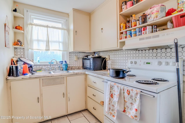 kitchen featuring black microwave, open shelves, white electric range, a sink, and under cabinet range hood