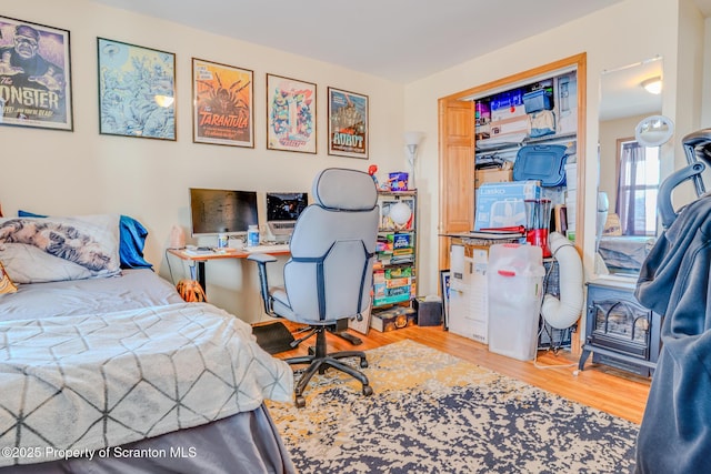 bedroom featuring a closet and wood finished floors