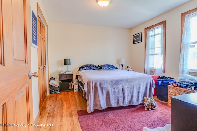 bedroom with light wood-type flooring
