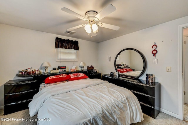 carpeted bedroom with ceiling fan