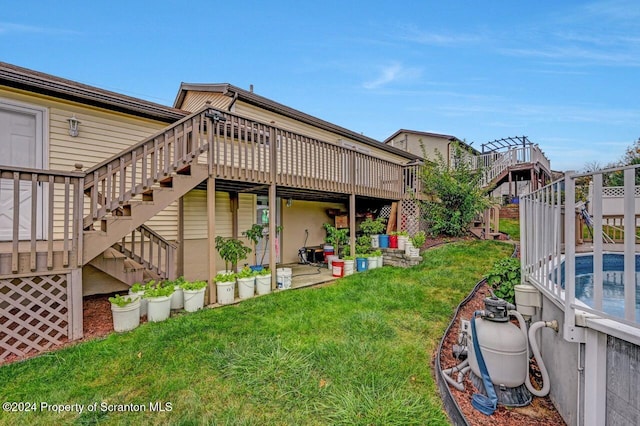 view of yard with a pool side deck