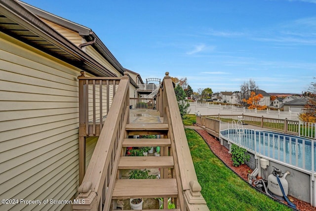 exterior space with a swimming pool side deck