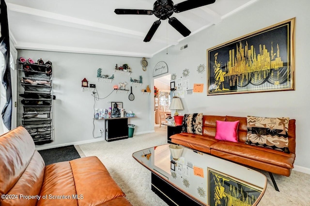 living room featuring beamed ceiling, ceiling fan, and carpet flooring