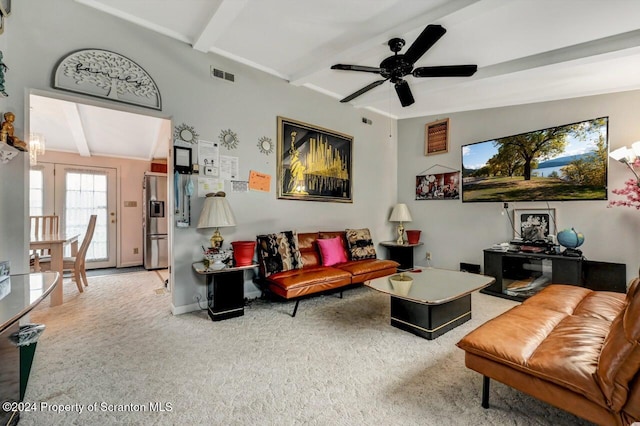 carpeted living room with vaulted ceiling with beams and ceiling fan