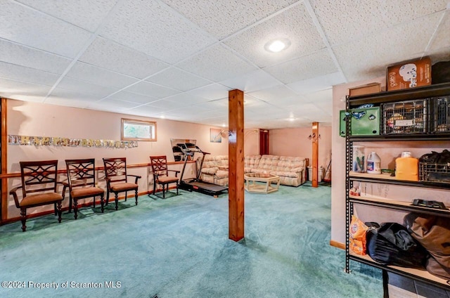 bedroom featuring carpet and a drop ceiling