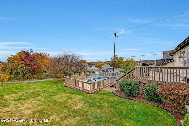 view of yard featuring a wooden deck