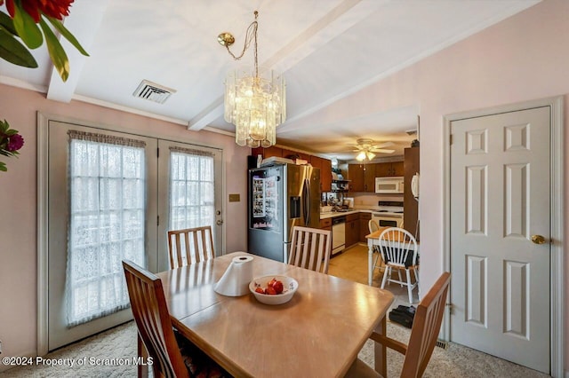 dining area featuring vaulted ceiling with beams and ceiling fan with notable chandelier